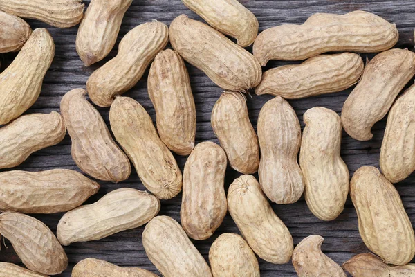 Dry peanut on wooden background. — Stock Photo, Image