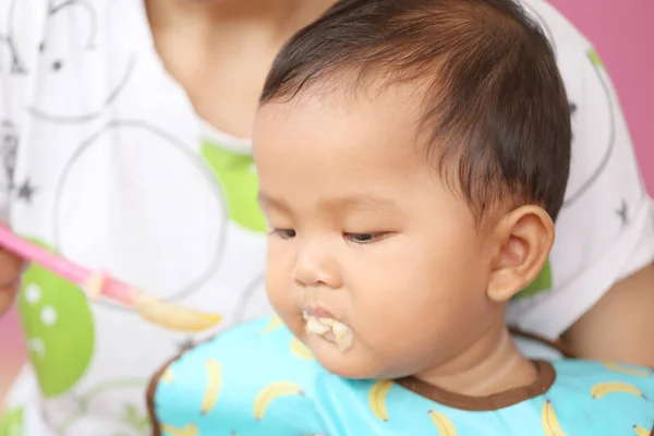 Asian baby boy to eating food in concept of health foods and nut — Stock Photo, Image