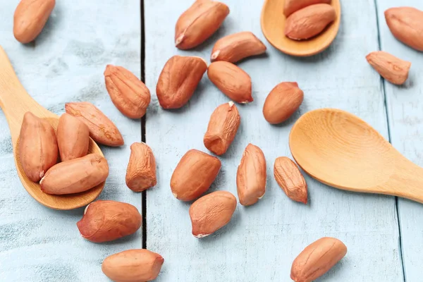 Peanuts on a wooden spoon. — Stock Photo, Image