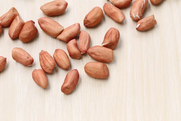 Focus fresh Peanuts on wooden background. — Stock Photo, Image
