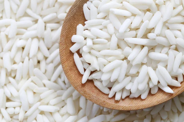 Organic white rice in wooden spoon, glutinous rice or sticky ric — Stock Photo, Image