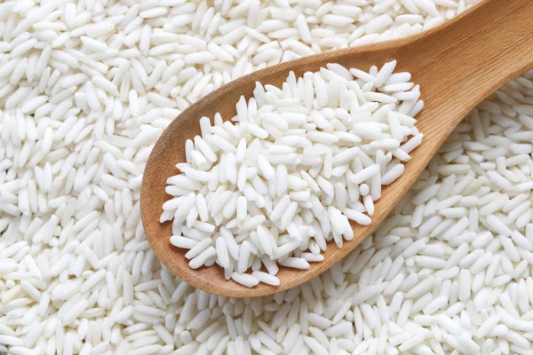 Organic white rice in wooden spoon, glutinous rice or sticky ric — Stock Photo, Image