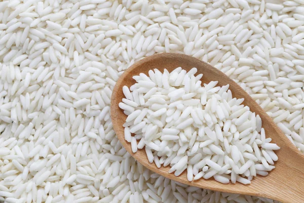 Organic white rice in wooden spoon, glutinous rice or sticky ric — Stock Photo, Image