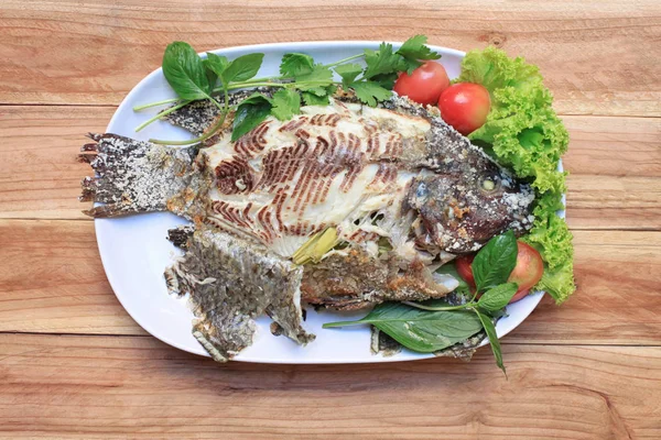 Tilapia fish grilled with Salt in white dish. — Stock Photo, Image