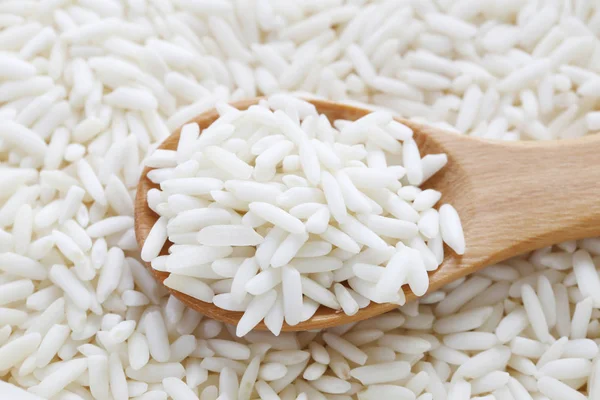 Organic white rice in wooden spoon, glutinous rice or sticky ric — Stock Photo, Image