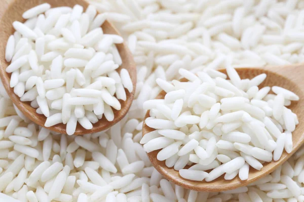 Organic white rice in wooden spoon, glutinous rice or sticky ric — Stock Photo, Image