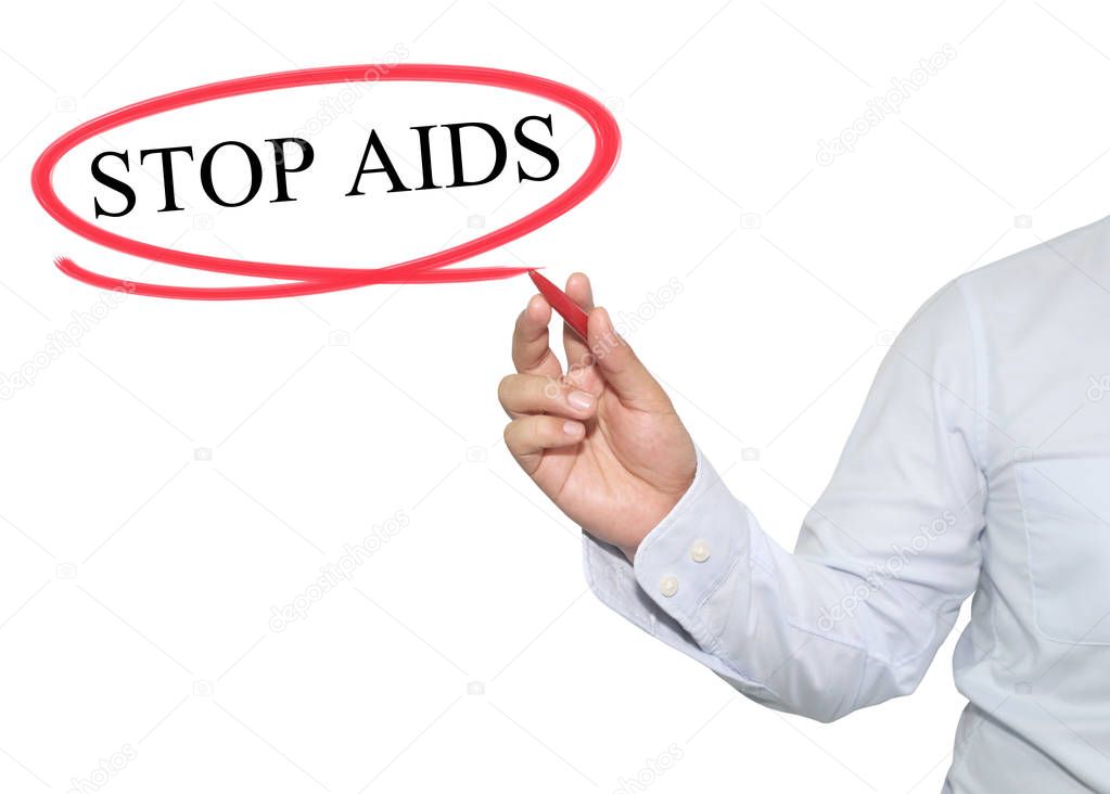 Hand of businessman write text in STOP AIDS.