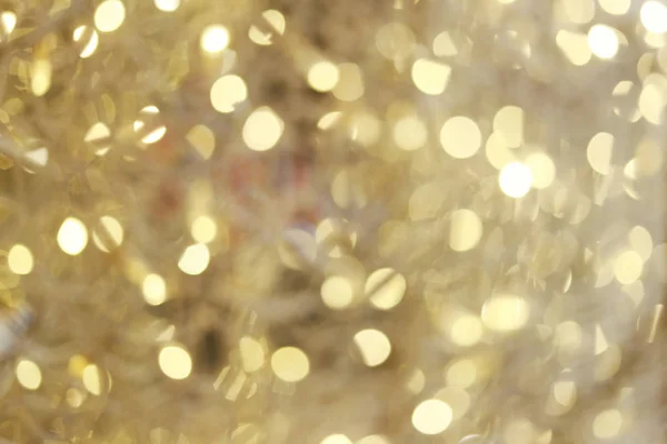 Bokeh de fundo ouro de luzes de Natal. — Fotografia de Stock