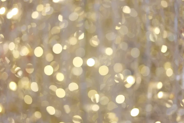Bokeh de fundo ouro de luzes de Natal. — Fotografia de Stock