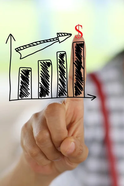 Finger of women touch to top business graph. — Stock Photo, Image