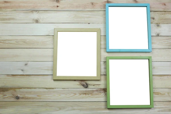 Picture frame of modern on wooden background. — Stock Photo, Image