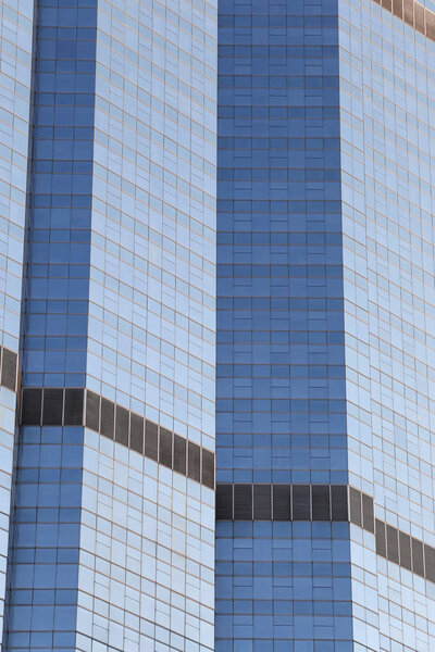 Wall of tall building or glass of skyscraper background for design in your work backdrop.