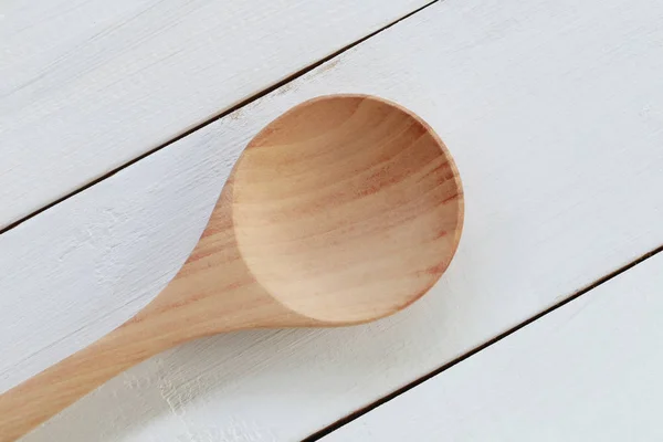 Wooden spoon on white wood background. — Stock Photo, Image
