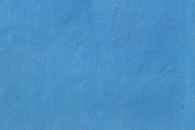 Mavi çimento duvar yüzeyine.