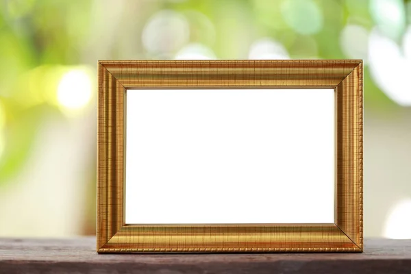 Modern Picture Frame placed on a wooden floor. — Stock Photo, Image