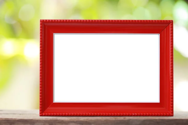 Modern Picture Frame placed on a wooden floor. — Stock Photo, Image