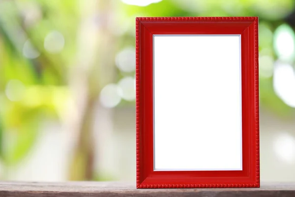 Modern Picture Frame placed on a wooden floor. — Stock Photo, Image