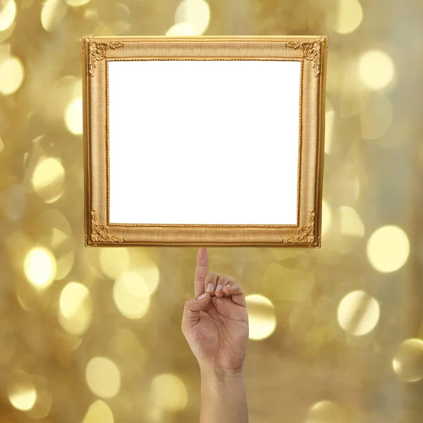 Finger of a businessman pointing to a Golden picture frame on bo — Stock Photo, Image