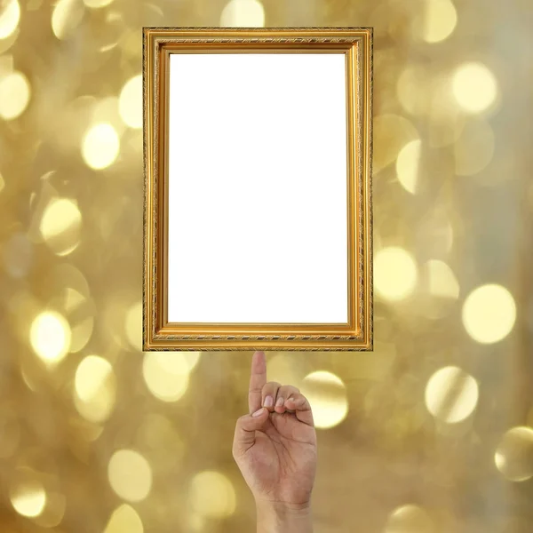 Finger of a businessman pointing to a Golden picture frame on bo — Stock Photo, Image
