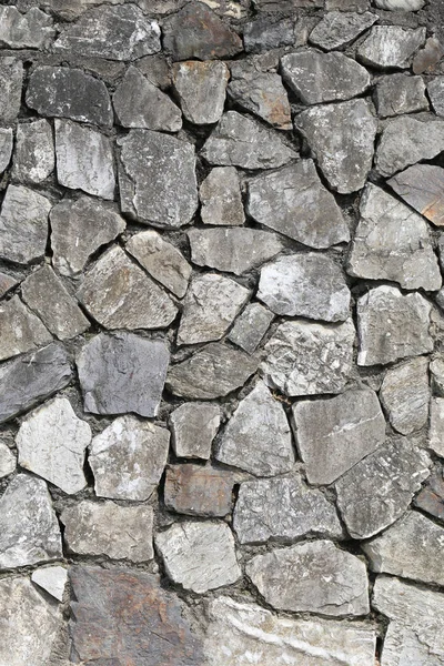 Oude stenen oppervlak van de muur achtergrond. — Stockfoto