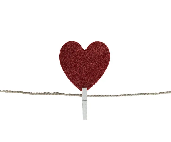 Red heart hanging on a hemp rope isolated on white background. Royalty Free Stock Images
