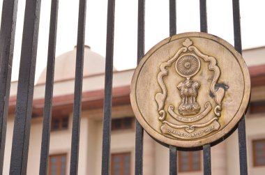 New Delhi, India, 2020. Supreme Court National Emblem, on the gate with its building in the background. The Supreme Court of India is a Symbol of justice, highest judicial and constitutional court. clipart