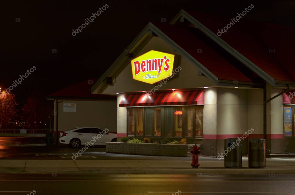 Niagara, Canada, 2020. Lit up board of popular Denny's restaurant retail chain outlet at night. An American table service diner-style restaurant chain. It operates over 1,600 restaurants worldwide