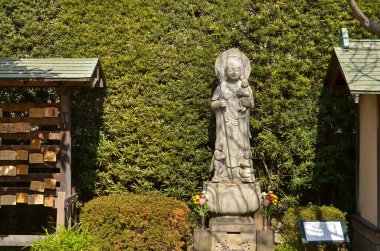 Grey stone statue in the temple