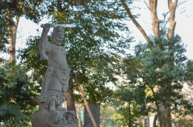 Grey stone statue in the temple