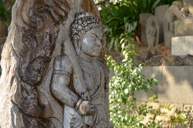 Grey stone statue in the park