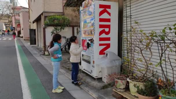 Children Using Vending Machine Take Out Juice Bottle — Stock video