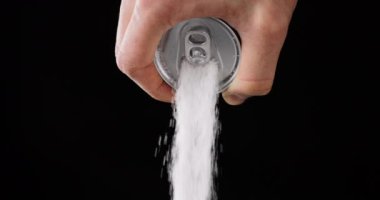Pouring Suger out of a soda can