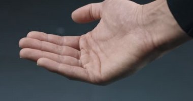 Dropping hand full of white pills