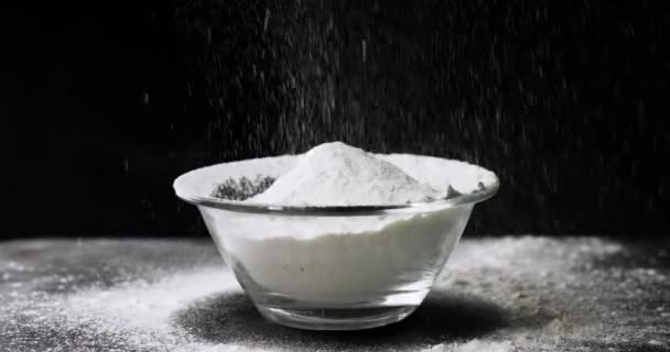 Flour falling on black background — Stok video