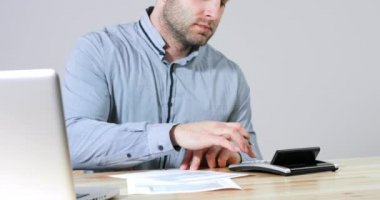 Businessman filling 1040 tax form