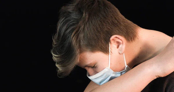 Teenager with face mask coughing — Stock Fotó