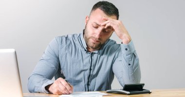Accountant businessman filling tax form