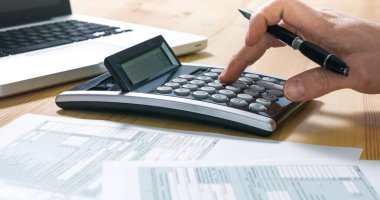 Businessman filling 1040 tax form