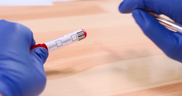 Marking Coronavirus infected blood sample tube — Stock videók