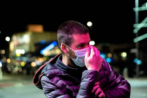 Man putting on face mask