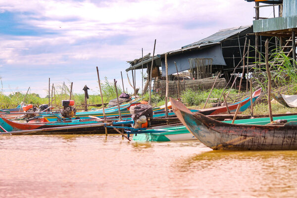 floating boat in the river in the village of mekong delta, vietnam