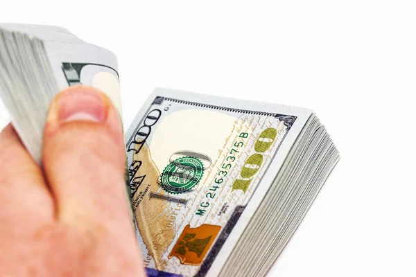 Zbliżenie w górę a mężczyzna ręka liczenie pieniądze z pieniądze stos odizolowany — Zdjęcie stockowe