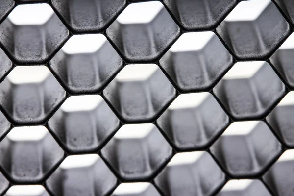 Preto Honeycomb Netting em um fundo branco — Fotografia de Stock