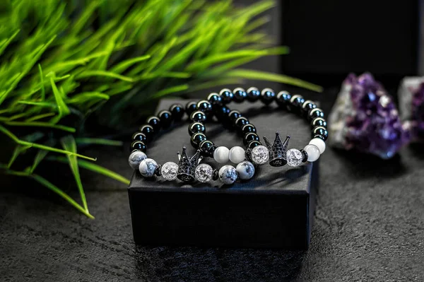 Close up of stone bracelets, accessories for him and her. Shallow depth of field
