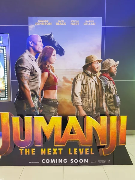 Jumanji: The Next Level movie poster, is a 2019 American fantasy adventure comedy film featuring Dwayne Johnson, Jack Black, Kevin Hart and Karen Gillan — Stock fotografie