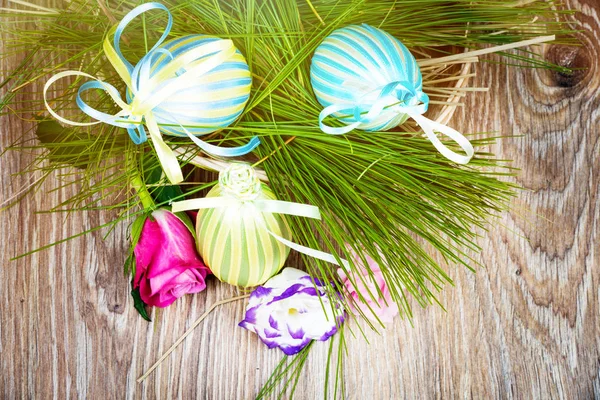 Easter eggs in the wicker on wooden background. Toned image — Stock Photo, Image