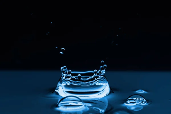 Photo of  water splashes and ripples background — Stock Photo, Image