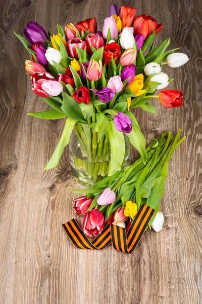 Mix of flowers in the vase on wooden background — Stock Photo, Image