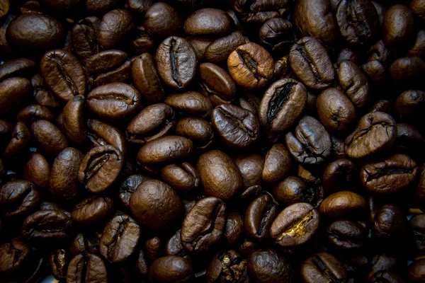 dark background of solid coffee beans