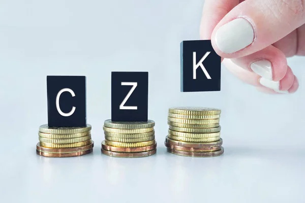 Concepto de moneda: CZK (Corona checa) texto apilado en monedas con —  Fotos de Stock